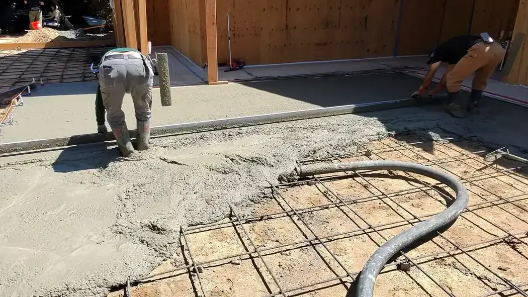 Concrete foundation work over a rebar grid
